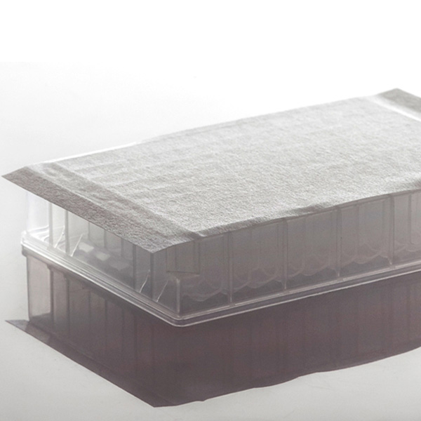 Cell culture adhesive seal, gas permeable